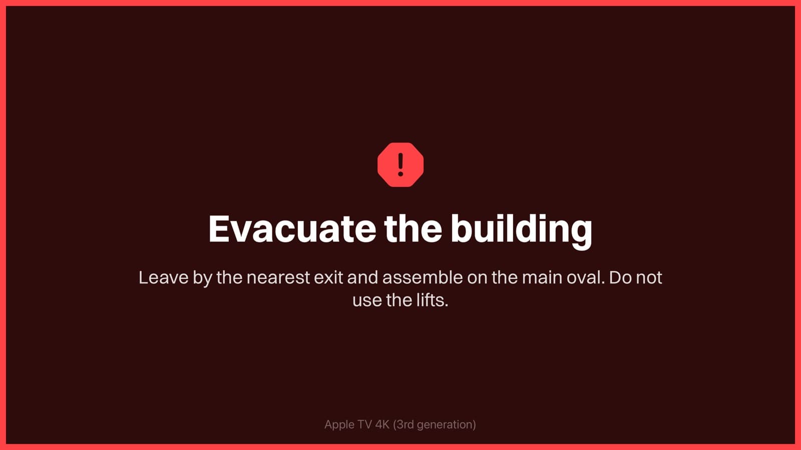 An Apple TV showing a full-screen evacuation alert in red
