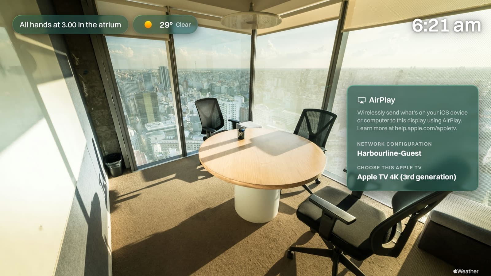 An Apple TV in a boardroom showing the AirPlay panel